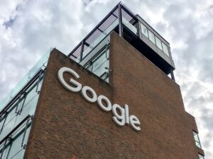Ilustrasi gedung dan papan nama kantor Google