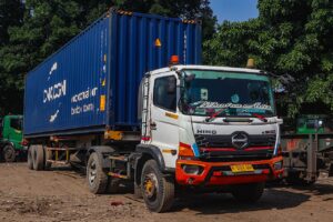 Truk barang melintas di jalan raya di Indonesia